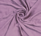 Close-up of purple fabric with a swirl pattern