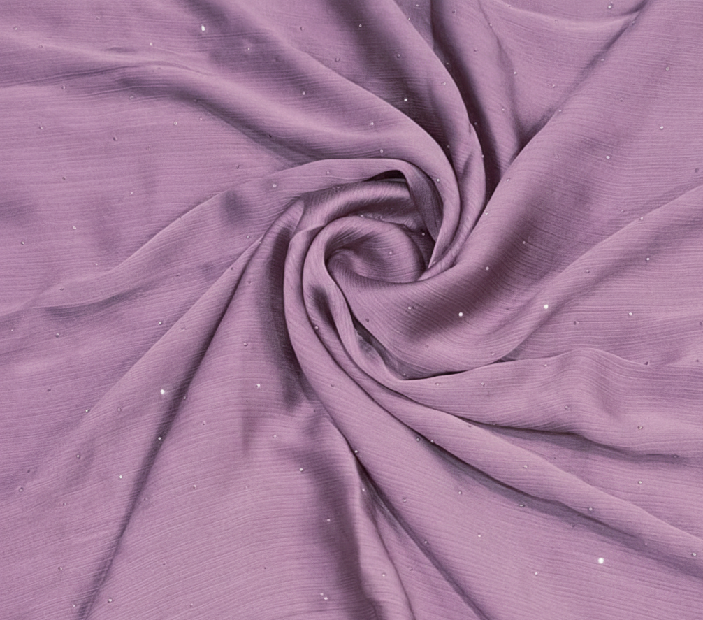 Close-up of purple fabric with a swirl pattern