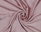 Close-up of pink fabric with a swirling pattern