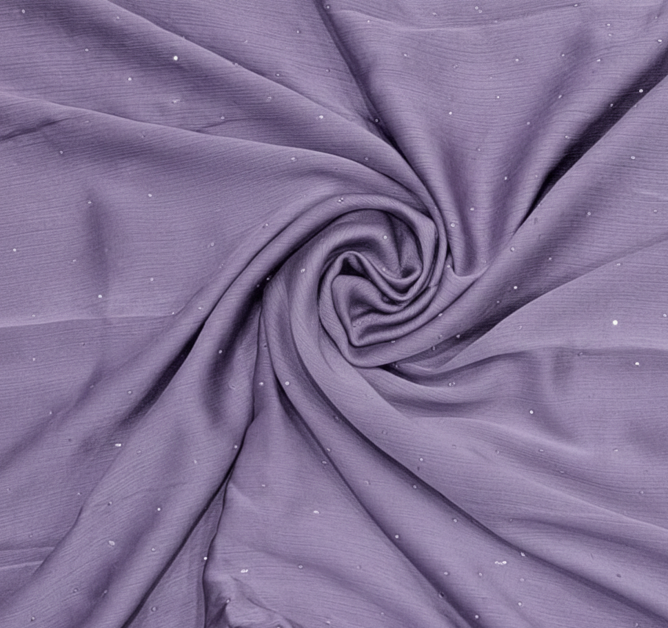 Close-up of purple fabric with a subtle pattern