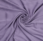 Close-up of purple fabric with a subtle pattern